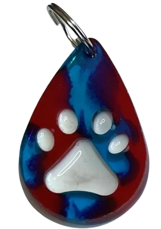 Handmade water drop-shaped charm with embossed paw