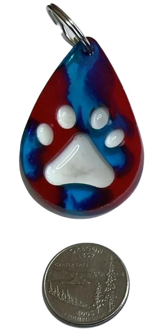 Handmade water drop-shaped charm with embossed paw