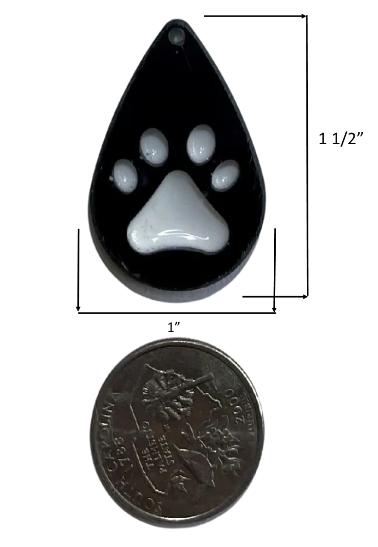 Small handmade black water drop-shaped charm with white paw